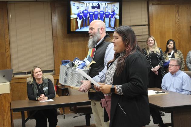 Shawnee High School student Kanynn Kaseca expresses her appreciation for the Shawnee Board of Education as SHS Principal Matt Johnson listens during the Jan. 8 meeting. Countywide &amp; Sun/Natasha Dunagan