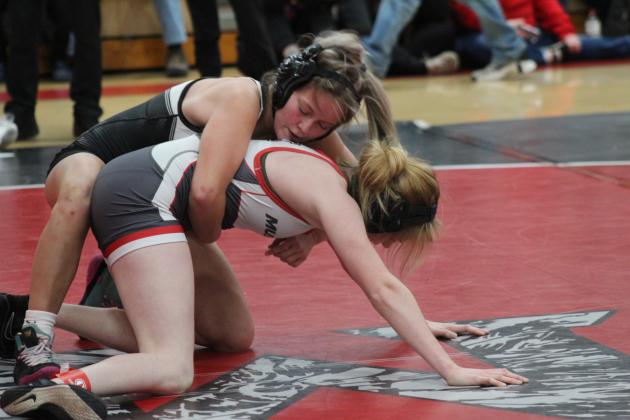McLoud's Addison Adams puts a hold on her Mustang opponent during the McLoud Redskin Rumble Girls Dual Championship on Jan. 20. McLoud High School hosted 16 teams for the fourth annual event. Broken Arrow was the final winner by criteria, after tying Bixby, 36-36, said McLoud Girls Wrestling Coach William Winters. McLoud was in the consolation bracket, having beaten Union, 51-24, and Mustang, 48-30, but falling to Del City, 30-39. Countywide &amp; Sun/Natasha Dunagan