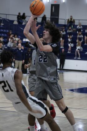 Shawnee freshman Edan Litherland aims for the basket in the Jan. 18 Lowe's/FireLake Arena Shawnee Invitational game with Broken Arrow. The Shawnee Wolves lost that game, 21-60; won the Jan. 19 game with Tahlequah, 57-49; and fell to El Reno, Jan. 20, 37-52. Countywide &amp; Sun/Natasha Dunagan