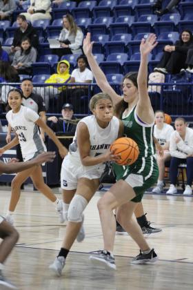 Shawnee senior Trinity Shirley drives to the basket during their first game of the Lowe's/Firelake Arena Shawnee Invitational on Jan. 18. The Lady Wolves beat Harding Prep, 40-21; lost to Class 6A Yukon, 33-44, on Jan. 19; and toppled Coweta, 45-33, Jan. 20, to take third place in the tournament. Countywide &amp; Sun/Natasha Dunagan