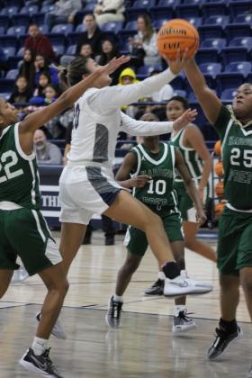Shawnee senior Tylyn Thurman runs to the paint for a layup during their first game of the Lowe's/Firelake Arena Shawnee Invitational on Jan. 18. The Lady Wolves beat Harding Prep, 40-21; lost to Class 6A Yukon, 33-44, on Jan. 19; and toppled Coweta, 45-33, Jan. 20, to take third place in the tournament. Countywide &amp; Sun/Natasha Dunagan