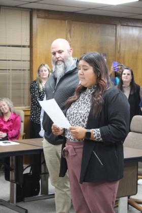 Shawnee High School student Kanynn Kaseca expresses her appreciation for the Shawnee Board of Education as SHS Principal Matt Johnson listens during the Jan. 8 meeting. Countywide &amp; Sun/Natasha Dunagan