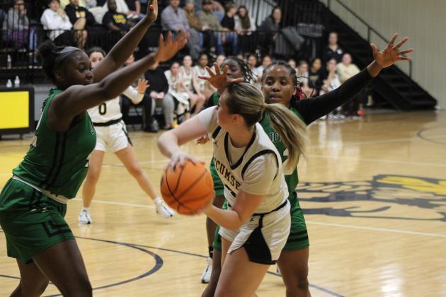 Tecumseh's Samantha Schweighardt tries to pass to Jadyn Wilson amidst some heavy defense during the Jan. 9 home game with Jones. The Lady Savages lost, 31-41. Countywide &amp; Sun/Natasha Dunagan