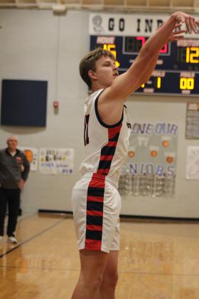 Asher's Andrew Overstreet tries for three points during the Feb. 10 Class B District game with Wapanucka, held at home. After getting a bye on the Feb. 9 game, the Indians won, 67-34 The Lady Indians also won their District game that night against Legacy Christian School, 45-14. Both teams will play in the Class B Regionals tonight in Chattanooga. Countywide &amp; Sun/Natasha Dunagan