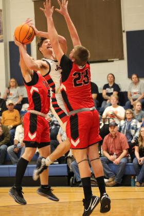 Asher's Mikey VanSchuyver tries to shoot around Stratford's defense and draws a foul during the Senior Night home game, Feb. 2. The Indians lost 49-51, but they will go on to play in District 3 competition at 7:30 pm, Feb. 10, at home. Countywide &amp; Sun/Natasha Dunagan