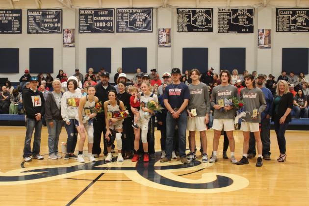 Asher High School held their Senior Night ceremony between the girls and boys basketball games on Feb. 2. The seniors and their families are shown here, including Alexis Johnston, fourth from left, Payton Leba, Ryleigh Reeser, Brogan Culwell, Bryce Lamb, Jordyn Litson and William Ranells. Countywide &amp; Sun/Natasha Dunagan
