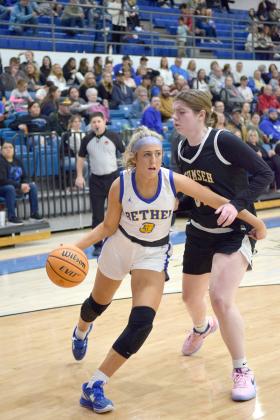 Alexis Tucker skirts around Reagan Berry heading to the basket.  Bethel lost to Tecumseh, 43-46 in the final seconds of the game. Countywide &amp; Sun/Julie Talton
