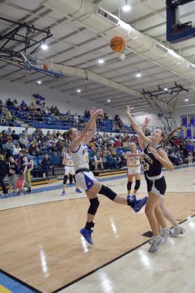 Josie Megehee sinks the ball in the matchup against Tecumseh on Feb. 2nd.  The Lady Wildcats lost the tense battle 43-46. Countywide &amp; Sun/Julie Talton