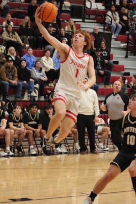 Dale's Easton Edmonson leaps up  to put one through the basket during the Class 2A District game with Mounds, Feb. 17. The Pirates stomped Mounds, 90-37, and will play in regional competition at Dale today (Feb. 22) at 7:30 pm.  Countywide &amp; Sun/Natasha Dunagan