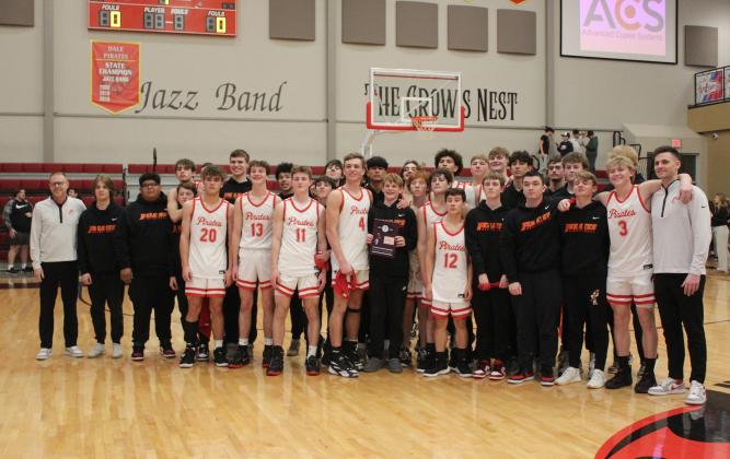 The Dale Pirates won their Class 2A District game with Mounds on Feb. 17, and are shown here with the District Champions plaque. They beat Mounds, 90-37, and will play in Regional competition today (Feb. 22) at 7:30 pm in Dale. Countywide &amp; Sun/Natasha Dunagan
