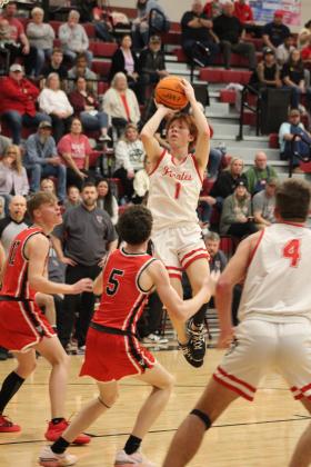 Dale’s Easton Edmonson catches a pass from Jett Higdon and sinks a basket during their last regular season home game, with Vanoss on Feb. 6. The Pirates won, 6835, and have a record of 22-2.