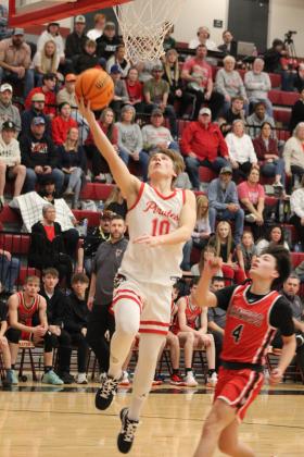Dale’s Levi Kelly catches a long pass and puts it through the hoop during their last regular season home game, with Vanoss.