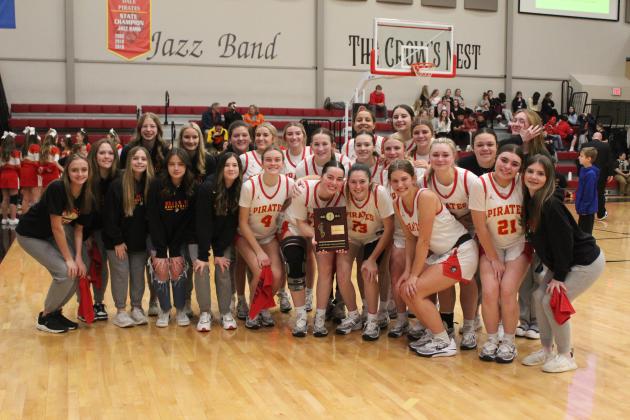 The Dale Lady Pirates pose after winning their Class 2A District Championship, 87-28, over Mounds. They will play the regional game in Dale today (Feb. 22) at 6 pm. Countywide &amp; Sun/Natasha Dunagan