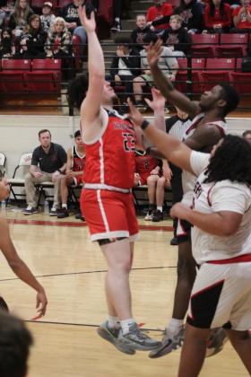 Earlsboro senior Danney Billingsley puts a shot over the Geary defense in the third quarter of the Class B Regionals on Feb. 15. Billingsley would injure his ankle, requiring  an ambulance, later in the game. The Wildcats won, 79-33, but lost the regional game with Varnum, Feb. 17, 65-78. They will play in Area competition today (Feb. 22) in Bridge Creek at 7:30 pm.  Countywide &amp; Sun/Natasha Dunagan