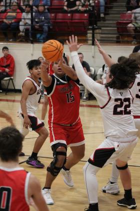 Earlsboro junior Quintin Lena passes the ball in the fourth quarter of the Class B Regionals on Feb. 15. The Wildcats won, 79-33, but lost the regional game with Varnum, Feb. 17, 65-78. They will play in Area competition today (Feb. 22) in Bridge Creek at 7:30 pm. Countywide &amp; Sun/Natasha Dunagan