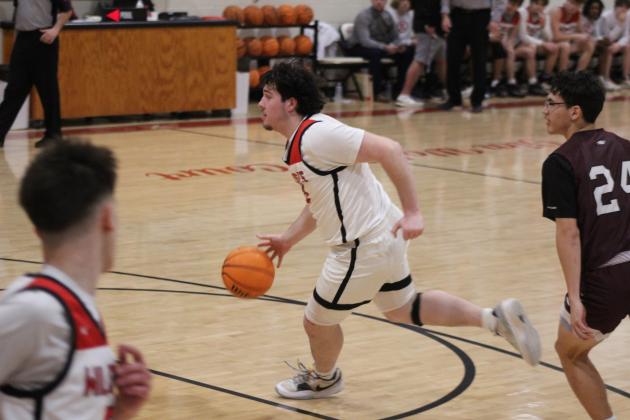 Earlsboro senior Danny Billingsley drives to the hoop and makes his shot in the first quarter of the Senior Night home game with Mason, Feb. 3. The Wildcats won, 76-46. Their District 8 game will be in Cement, Feb. 9, at 7:30. Countywide &amp; Sun/Natasha Dunagan