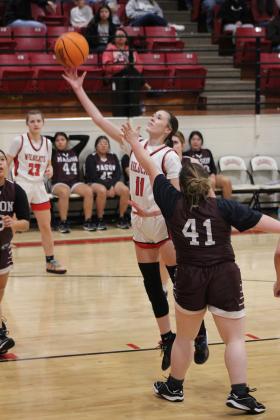 Earlsboro junior Natalie Peters lifts up a layup during the Senior Night home game with Mason, Feb. 3. The Lady Wildcats won, 49-24. Their District 8 game will be today in Cement at 6:30 pm. Countywide &amp; Sun/Natasha Dunagan