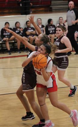 Earlsboro freshman Mia Tanyan struggles to make a basket, drawing a foul, during the Senior Night home game with Mason, Feb. 3. The Lady Wildcats won, 49-24. Their District 8 game will be today in Cement at 6:30 pm. Countywide &amp; Sun/Natasha Dunagan