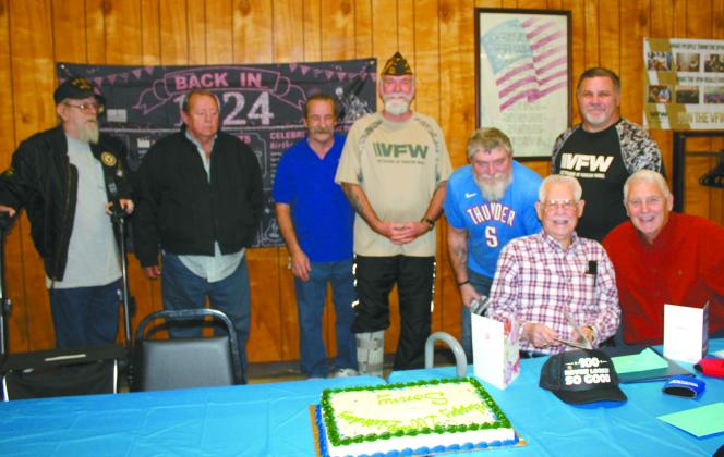 Noah "Sonny" Hines, seated with card, celebrated his 100th birthday at the Veterans of Foreign Wars Post 1317 in Shawnee on Feb. 5. Those in attendance included, from left, VFW Post Chaplain Danny Brown, VFW Member Wayne Linn, VFW Senior Vice Commander Don Plumley, Post Commander Patrick Koch, VFW Quartermaster James Wear, Hines, Past Department of Oklahoma Commander James Dockmeyer and Shawnee Mayor Ed Bolt. Countywide &amp; Sun/Natasha Dunagan