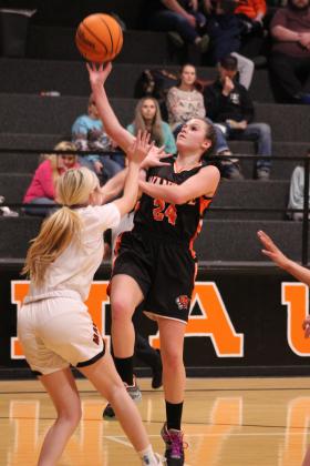 Wanette's Cassi Johnson takes a steal to the basket, as Maud's Aubri Keuneman plays defense in the first quarter of the homecoming game on Jan. 26. Countywide &amp; Sun/Natasha Dunagan