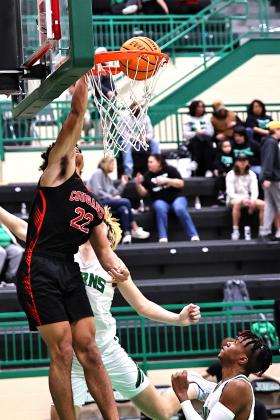 North Rock Creek's Caleb Hawkins got a steal and dunks the ball in action against Jones. Photo courtesy of Gowin Photography
