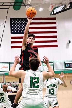 North Rock Creek's Devon Haney shoots over the Jones player. Photo courtesy of Gowin Photography