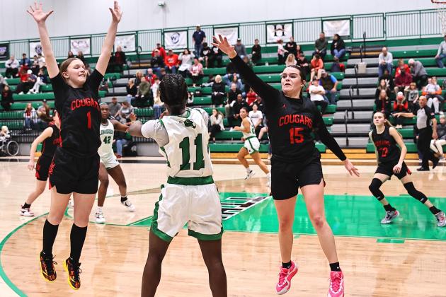 North Rock Creek's  Addison Lawrence and Morgan Campbell puts pressure on the Jones player bringing the ball up. Photo courtesy of Gowin Photography