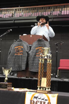 Tecumseh High School alum Justin Dailey serves as the auctioneer during the 35th Annual PCJLS Pig Roast and Trophy Auction. Countywide &amp; Sun/Natasha Dunagan