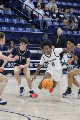 Shawnee junior Daytain Patton drives toward the hoop during their last regular season home game, with Altus  on Feb. 9. The Wolves won, 73-56. Countywide &amp; Sun/Natasha Dunagan