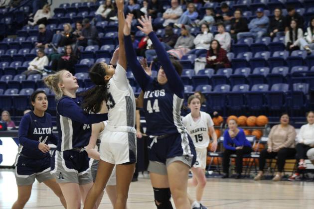 Shawnee freshman Tatyanna Thierry puts up a shot over an Altus defender during the Senior Night home game, Feb. 9. The Lady Wolves won, 59-35, and have a record of 15-7. Countywide &amp; Sun/Natasha Dunagan