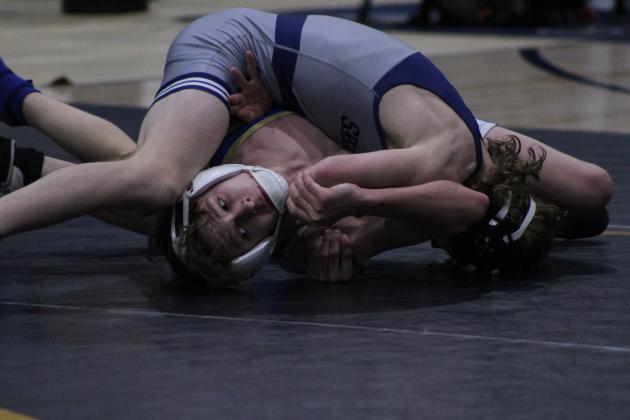Shawnee's Booker Dahlman, top, pins Noble's Erhan Prior during the dual meet on Jan. 25, held at the PAAC. Countywide &amp; Sun/Natasha Dunagan