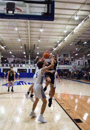Tecumseh's Aden Boone fights Bethel for the basket on Feb. 2nd. The  Savages won the contest  in double overtime 64-60. Countywide &amp; Sun/Julie Talton
