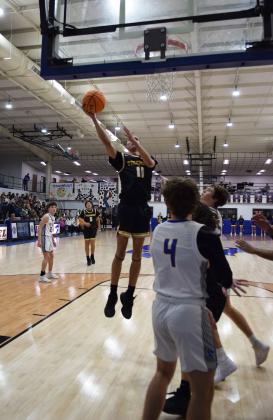 Tecumseh's, Aden Boone tosses the ball in to extend the lead in the game against Bethel on Feb. 2nd. Tecumseh won the double overtime matchup 64-60. Countywide &amp; Sun/Julie Talton
