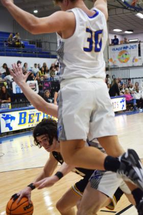Tecumseh's Macen McKiddy dodges Bethel's Cale Duncan during the double overtime matchup on Feb. 2nd. The Savages took the win 64-60. Countywide &amp; Sun/Julie Talton