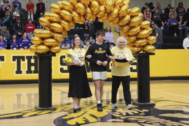 Teachers Renee Wootten, far left, and Murna Lack served as the flower girl and crown bearer, respectively, during Tecumseh High School's Spring Homecoming ceremony. They were escorted by Colton Kline. Countywide &amp; Sun/Natasha Dunagan