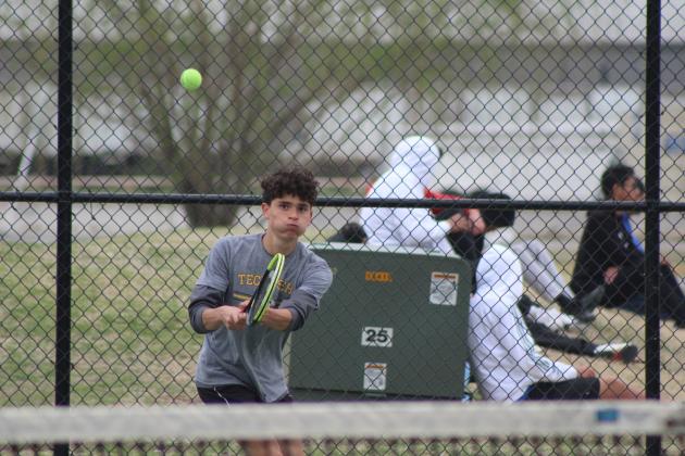 Tecumseh's Marco Espinoza returns the ball during the Shawnee High School Tennis Tournament on March 15.