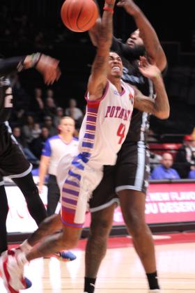 Potawatomi Fire point guard Chuck Guy is fouled as he goes to the hoop.
