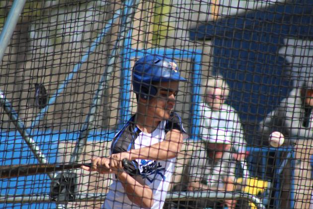 Bethel student J.P. O'Leary keeps his eye on the ball before hitting a home run during the Alumni Home Run Derby at the Bethel Bash on March 2. Countywide &amp; Sun/Natasha Dunagan