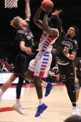 Potawatomi Fire center Jon Cathey-Macklin goes up for a shot during their first game of the third season on March 1. The Basketball League National Champions beat the Enid Outlaws at FireLake Arena, 136-91. Countywide &amp; Sun/Natasha Dunagan