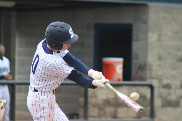 Shawnee sophomore Dominic Denega makes contact while at bat during the home game with Harrah on March 22. Harrah won both games in the double header, 8-0 and 3-1. Countywide &amp; Sun/Natasha Dunagan