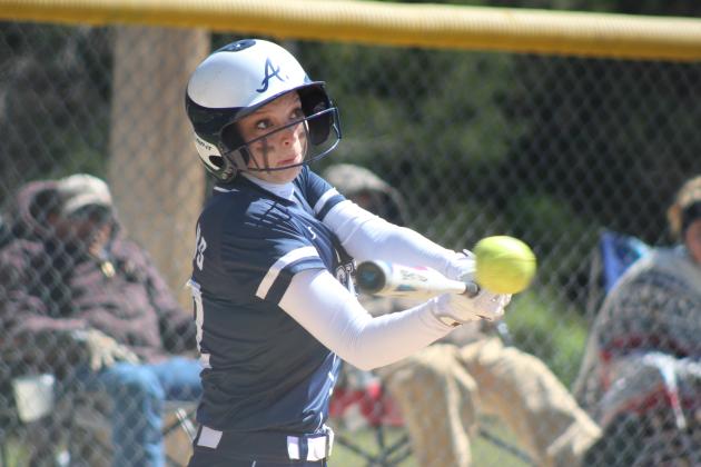 Asher senior Magi Melton prepares to send the ball flying during the RWB Tournament game against Roff at Asher on March 26. The Lady Indians beat Roff, 4-2; Konawa, 19-5; and Wayne, 11-7, all in one day, to win the tournament. Countywide &amp; Sun/Natasha Dunagan