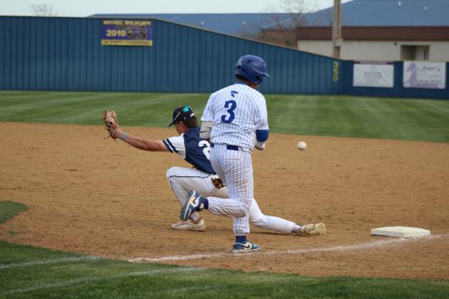 Bethel freshman Maddox Davis runs to first, as Asher senior Brogan Culwell tries for the catch during the Bethel Festival, March 29. The Wildcats beat the Indians, 14-5, and they stomped the OKC Mets, 6-1. Countywide &amp; Sun/Natasha Dunagan