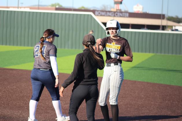 Tecumseh freshman Haley Mansell gets a fist bump from Assistant Coach Kayla Rodriguez after hitting a single in the Dale Slowpitch Festival game with Southmoore on April 11 at the FireLake Ball Fields. The Lady Savages won that game, 10-9, and earlier with Hinton, 10-2. Countywide &amp; Sun/Natasha Dunagan
