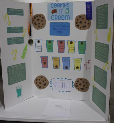 Koltin Crothers, a fifth-grader at Tecumseh, got a blue ribbon and gold medal for his "Cookies n' Cream" project, in which he tested how long cookies would float in different types of liquid. Countywide &amp; Sun/Natasha Dunagan