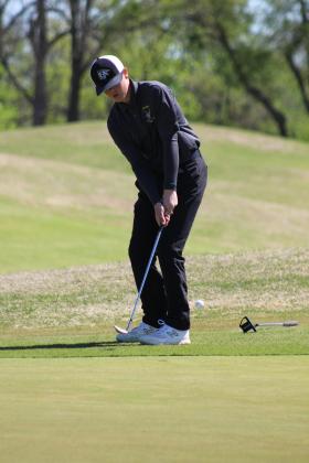 Tecumseh freshman Grayson Sellers putts toward the 10th hole at FireLake Golf Course during the Tecumseh Boys Golf Tournament on April 11. Countywide &amp; Sun/Natasha Dunagan