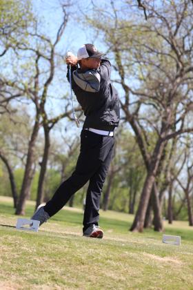 Tecumseh sophomore Wyatt Cosper watches the ball as it flies toward hole #10 at FireLake Golf Course during the Tecumseh Boys Golf Tournament on April 11. Countywide &amp; Sun/Natasha Dunagan