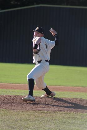 Tecumseh senior Kaiden Pounds winds up for the pitch during the April 4 game with North Rock Creek. The Savages lost, 0-3. Countywide &amp; Sun/Natasha Dunagan
