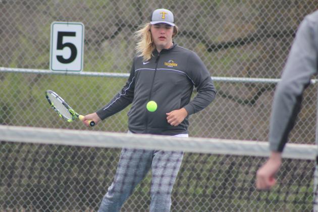 Tecumseh sophomore Ted Belshe returns the ball during the Tecumseh Tennis Tournament, April 2. Belshe and his tennis partner Jessy Thoma competed in #2 Doubles. Tecumseh High School hosted eight schools for the event. Countywide &amp; Sun/Natasha Dunagan