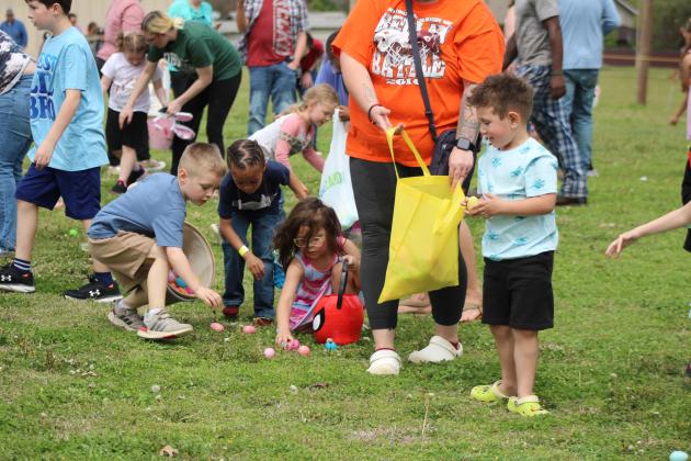 Four- and five-year-olds scoop up plastic eggs during the Tecumseh Citywide Easter EGGsperience on March 30, organized by the Tecumseh Assembly of God Church. There were 8,000 eggs to collect, prize drawings, inflatables, live music, hotdogs and drinks at the event. Countywide &amp; Sun/Natasha Dunagan