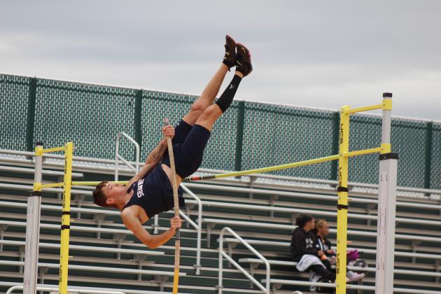 Shawnee's Keifer Landes is inverted as he competes in pole vaulting during the track and field meet held at OBU on April 9. Countywide &amp; Sun/Natasha Dunagan